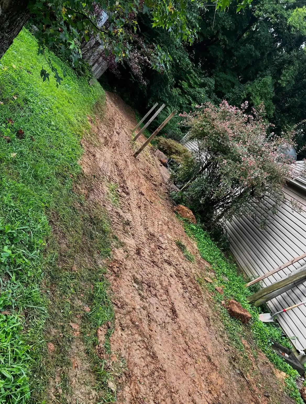 Backyard slope regraded and smoothed after drainage repair