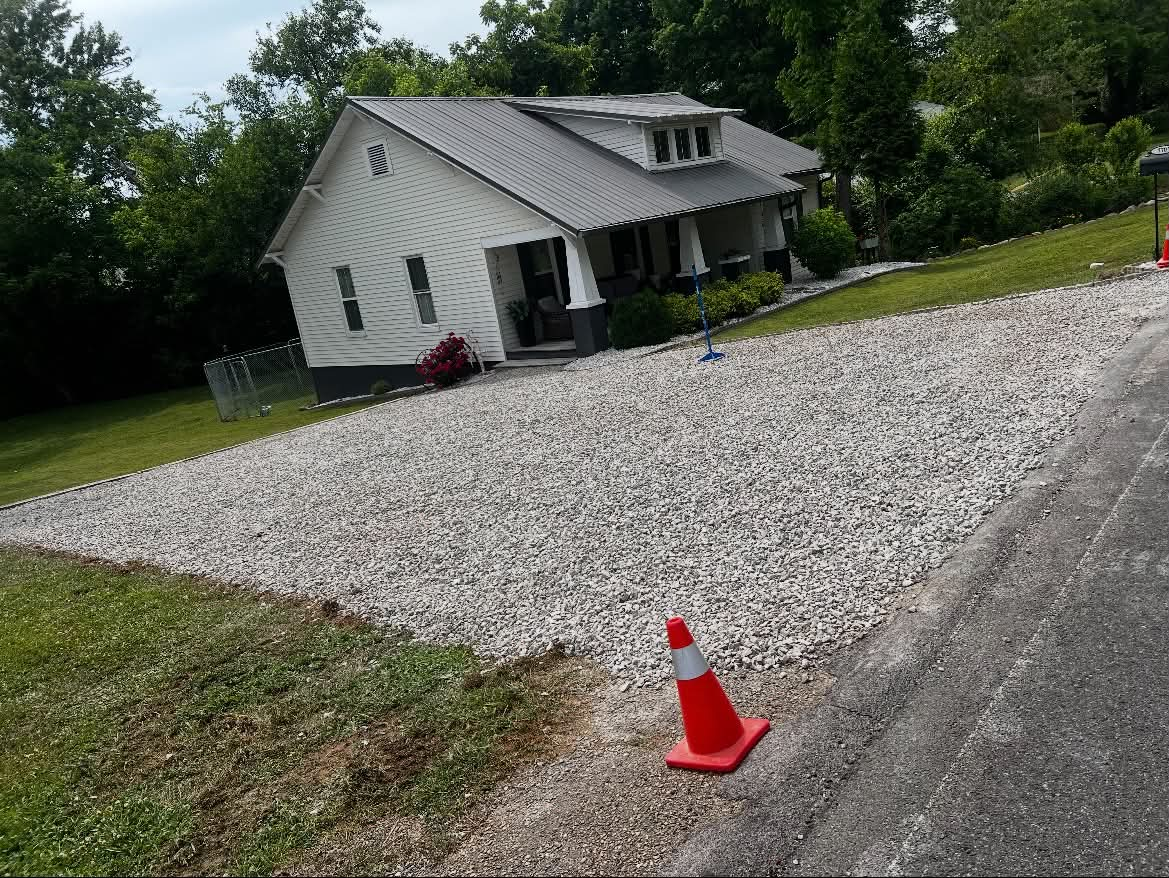 Finished gravel driveway with clean edges after restoration